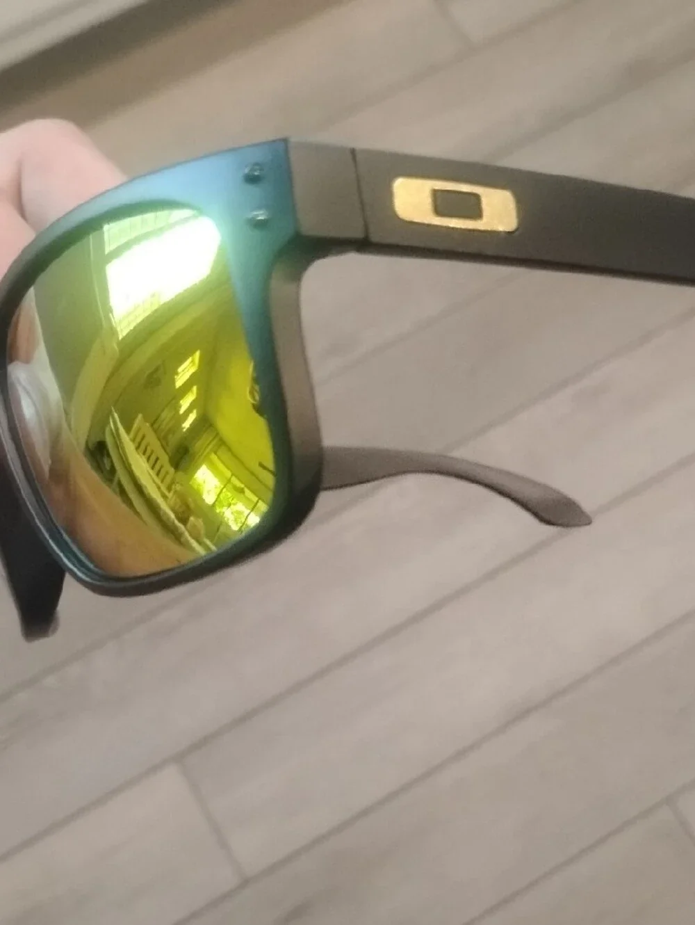 Oakley Matte Black Sunglasses with Yellow-Orange Mirror Lenses